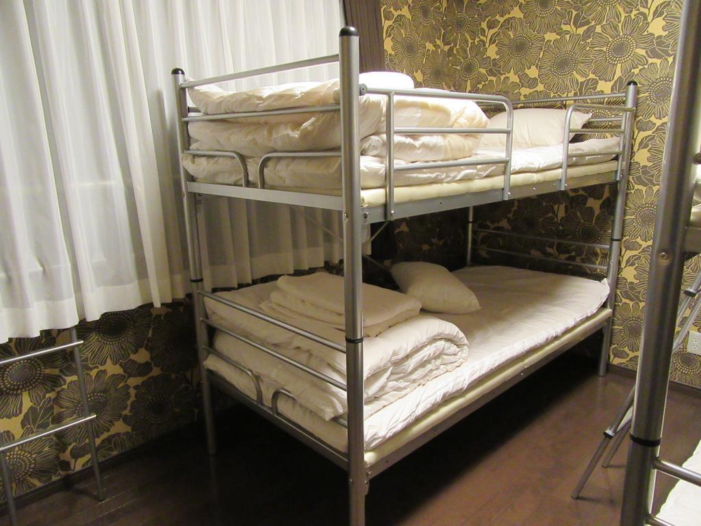 Guesthouse Tiga Kumamoto Rum bild
